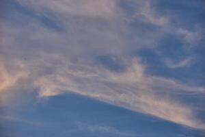 White clouds on blue sky background in the sunny afternoon photo