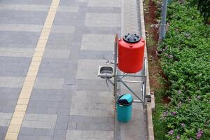 Public hand washing facilities on the sidewalk of Sudirman Street, Jakarta. The handwashing facilities installed widely in the public area to prevent spread of Covid-19 viruses photo