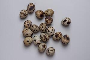 Top View of Quail eggs in a bowl isolated on white background photo