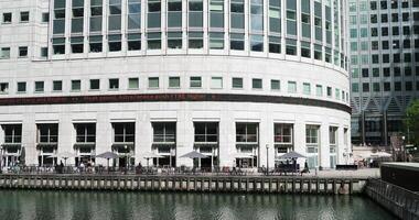 A large building with many windows and a large body of water video