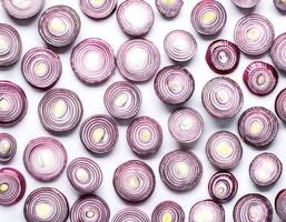 red onion slices. pattern texture background. isolated on white background photo
