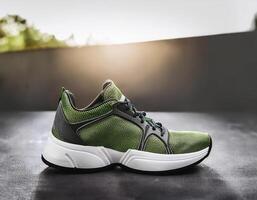 A pair of insulated running shoes on a concrete surface. Sports Shoes photo