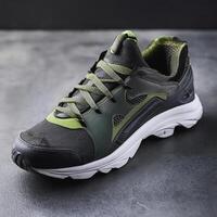 A pair of insulated running shoes on a concrete surface. Sports Shoes photo