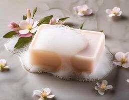 Bar soap is kept on a minimalist background with flowers surrounding it and foam photo