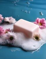 Bar soap is kept on a minimalist background with flowers surrounding it and foam photo