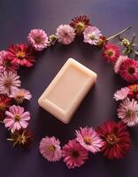 Bar soap is kept on a minimalist background with flowers surrounding it photo