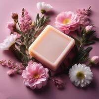 Bar soap is kept on a minimalist background with flowers surrounding it photo