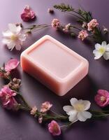 Bar soap is kept on a minimalist background with flowers surrounding it photo