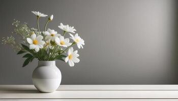 Fresh flowers in a simple vase on a table with a minimalist background photo