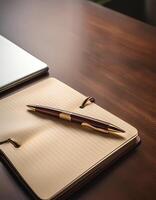 Pen and notebook placed on a clean table photo