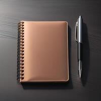 Pen and notebook placed on a clean table photo