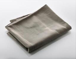 Plain folded cloth with white background photo