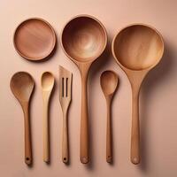 Wooden cooking utensils neatly isolated on minimalist background photo
