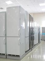 Rows of modern fridges in a store photo
