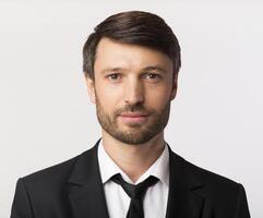 ID Photo. Portrait Of Businessman In Suit Looking Friendly At Camera Over White Background. Studio Shot, Isolated photo