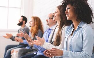Appreciating success. Group of diverse people clapping hands at meeting, free space photo
