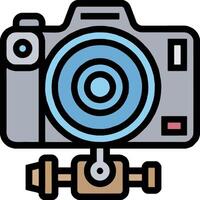 A camera with a lens and a tripod vector