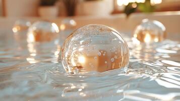 Clear bubbles float gracefully to the surface of calm water, capturing sunlight and creating a tranquil atmosphere in the afternoon light. photo