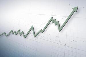 Green zigzag line fluctuates on white grid chart, representing data analysis photo
