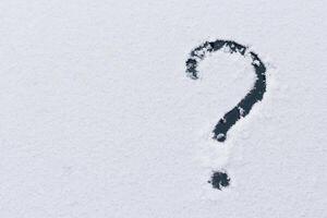 Question mark on the snow. photo