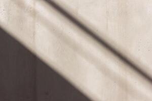 Concrete texture. Grey wall with sunlight and shadow. Abstract background. photo