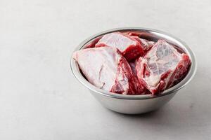 Raw beef ribs in bowl photo