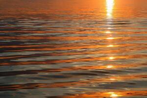 Beautiful sunset waves, natural water background photo
