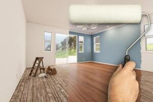 Before and After of Man Using A Paint Roller to Reveal Newly Remodeled Room with Fresh Green Paint, Coffered Ceiling and New Floors. photo