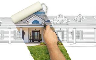 Before and After of Man Painting Roller to Reveal Custom Home Photograph Under Pencil Sketch Drawing Plans. photo