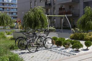 Bicycle parking in a modern European courtyard of an apartment building photo