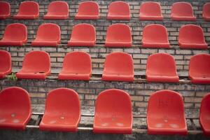 Sports stand. Empty seats in the stadium. Chairs in the stadium. photo