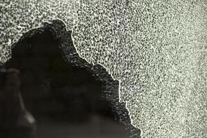 Broken glass. Cracks in the window. Many small cracks. photo