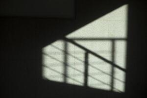 Shadow from the stairs on the wall. Abstract shadow. Perilla reflected on the surface. photo