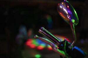 Chrome motorcycle part. Motorcycle at the disco. Chrome handle. photo