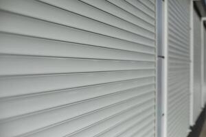 Blinds on window. Shutters on windows of office. Grey shutters. photo