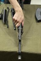 Possession of weapons. Training in use of weapons. Military Trinity. photo