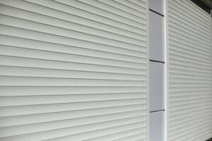 Blinds on window. Shutters on windows of office. Grey shutters. photo