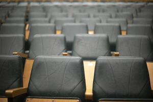 Lot of seats in hall. Empty spaces. Seating area. photo