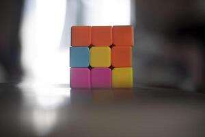 Intellectual game. Cube made of different colored tiles. A game for the mind. photo