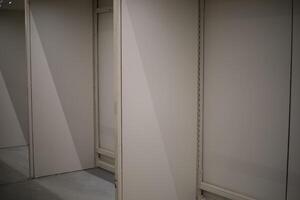 Doors made of wood. Partitions made of boards. Changing cabins. photo