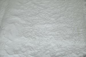 espuma textura. blanco jabón solución. un capa de espuma en el superficie. foto