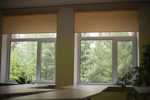 Windows in auditorium. Two large windows in room. Natural light in classroom. photo