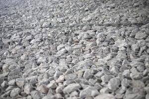 Texture of stones. Stones under the net. Drainage system. photo
