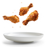 floated Fried chicken legs falling into the white plate isolate on transparency background png