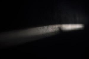 Line of light on the wall. Beam on the surface. Light and shadow. photo