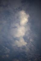 Clouds in the sky. Vertical shot of clouds. Air space. photo