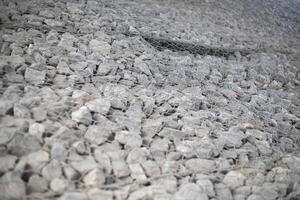 Texture of stones. Stones under the net. Drainage system. photo