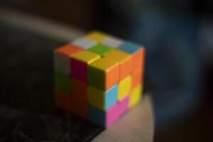 Intellectual game. Cube made of different colored tiles. A game for the mind. photo
