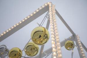 Garlands for the New Year. Balls on the structure. Decoration of the city. photo