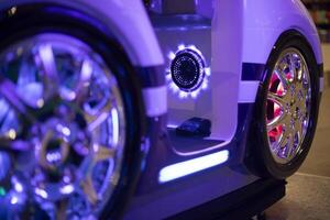 Children's car in a shopping center. Attraction for children. Wheels of a small car. photo